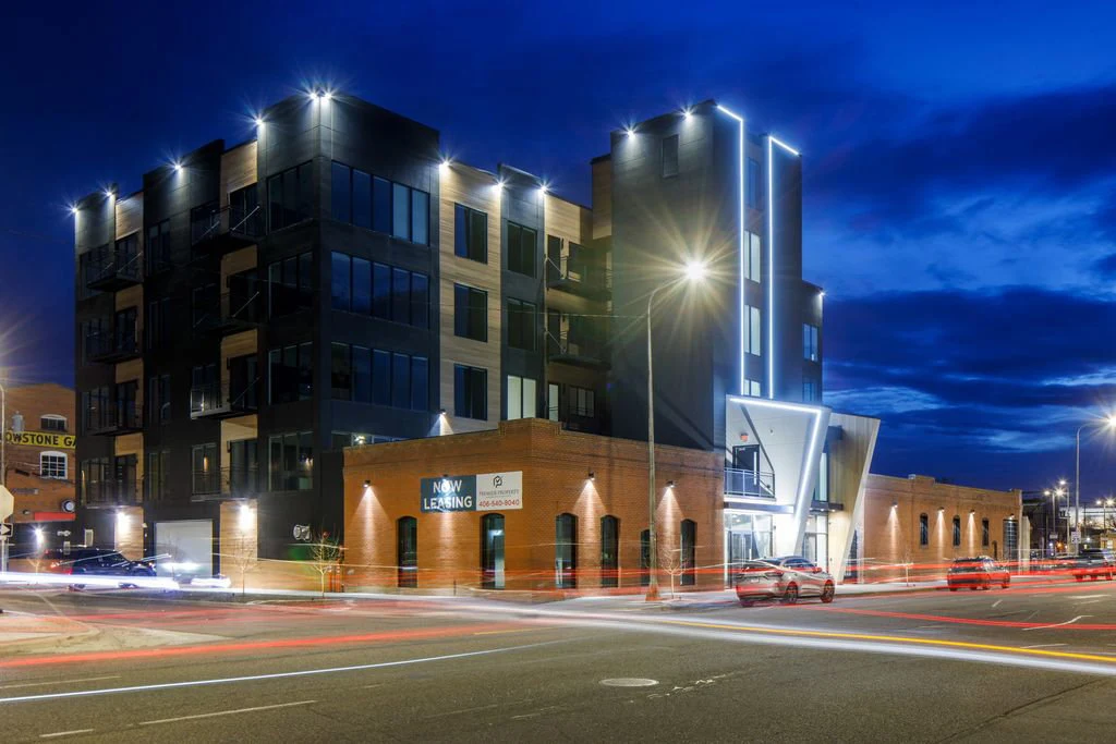 Old Town Flats illuminated at dusk in downtown Billings